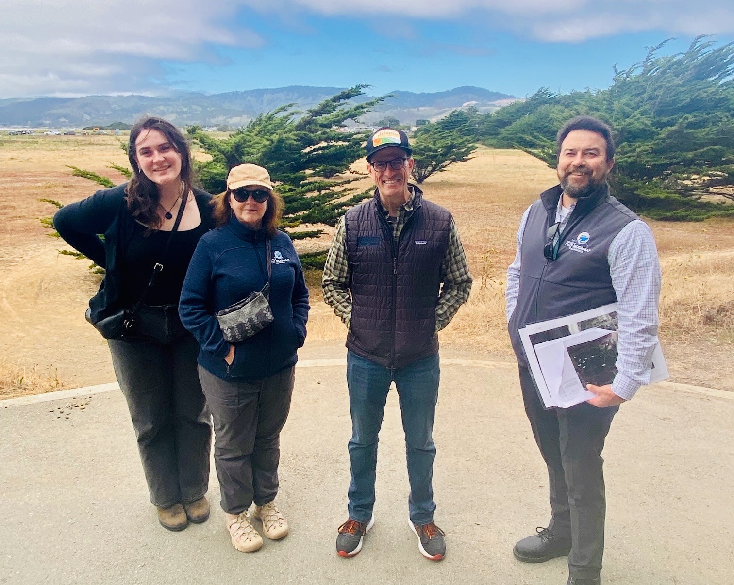 Debbie Ruddock reviewing project plans with Assembly Member Marc Berman, Half Moon Bay City Engineer Dale Ledas, and Staff Director Joan Dentler