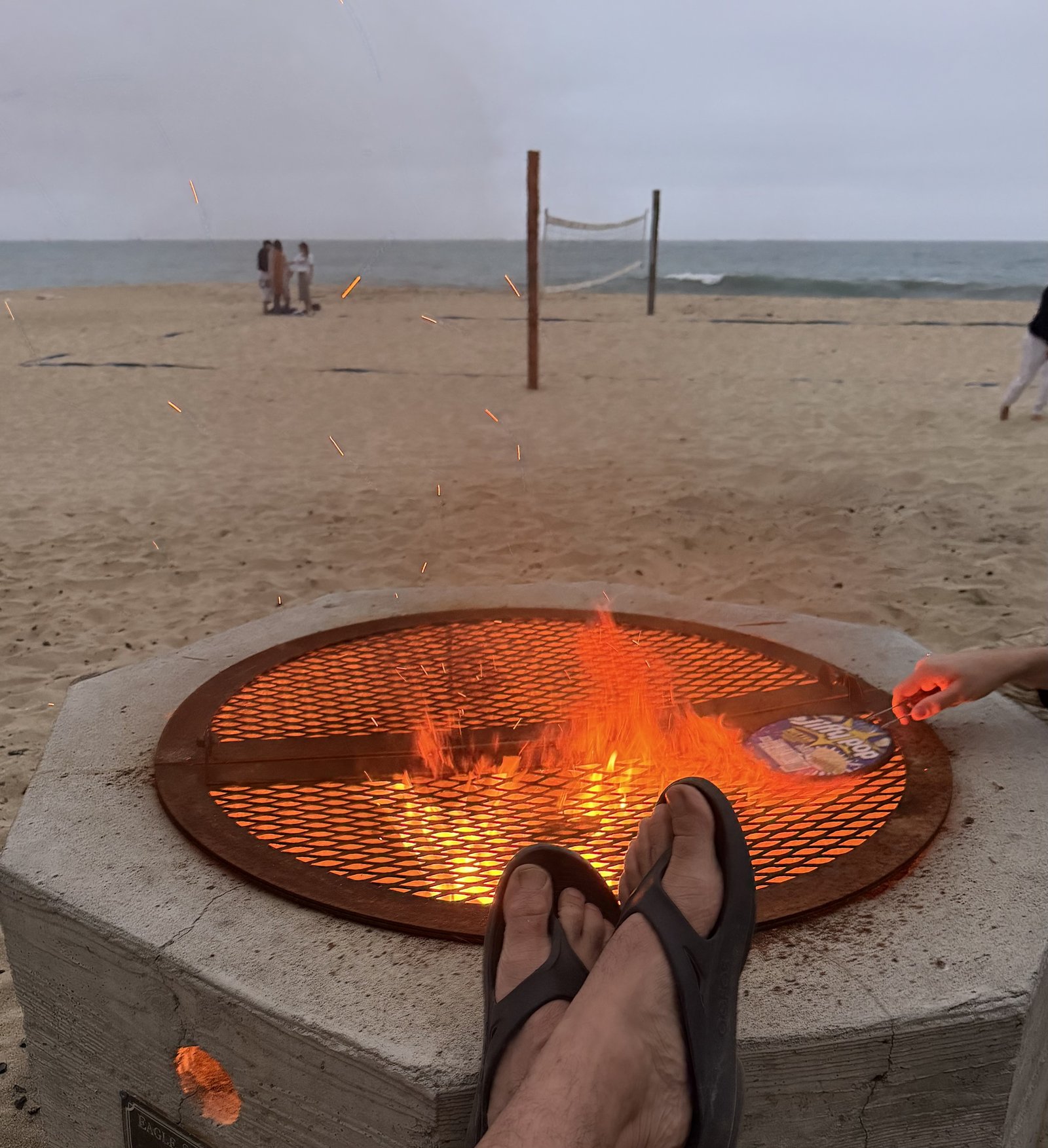 Enjoying fire pits and beach volleyball at Poplar Beach
